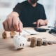 Putting Coin in Piggy Bank