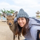 Girl taking selfie with Deer