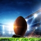 Football in Lit Up Stadium