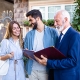 Young Couple Talking to Real Estate Agent