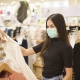 Girl with Face Mask in Shop