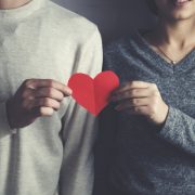 Couple Holding Red Heart