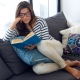 Woman Reading Book on Couch