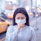 Woman Coughing with Mask On