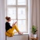 Girl Reading Book in Window