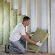 Man Insulating Home