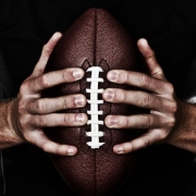 Football Player Holding Ball