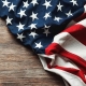 American Flag on Wood Background