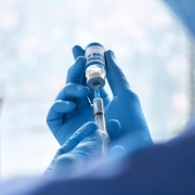 Doctor Holding Vaccine Syringe