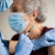 Doctor Giving Coronavirus Vaccine