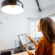 Woman Adjusting Lights in Home